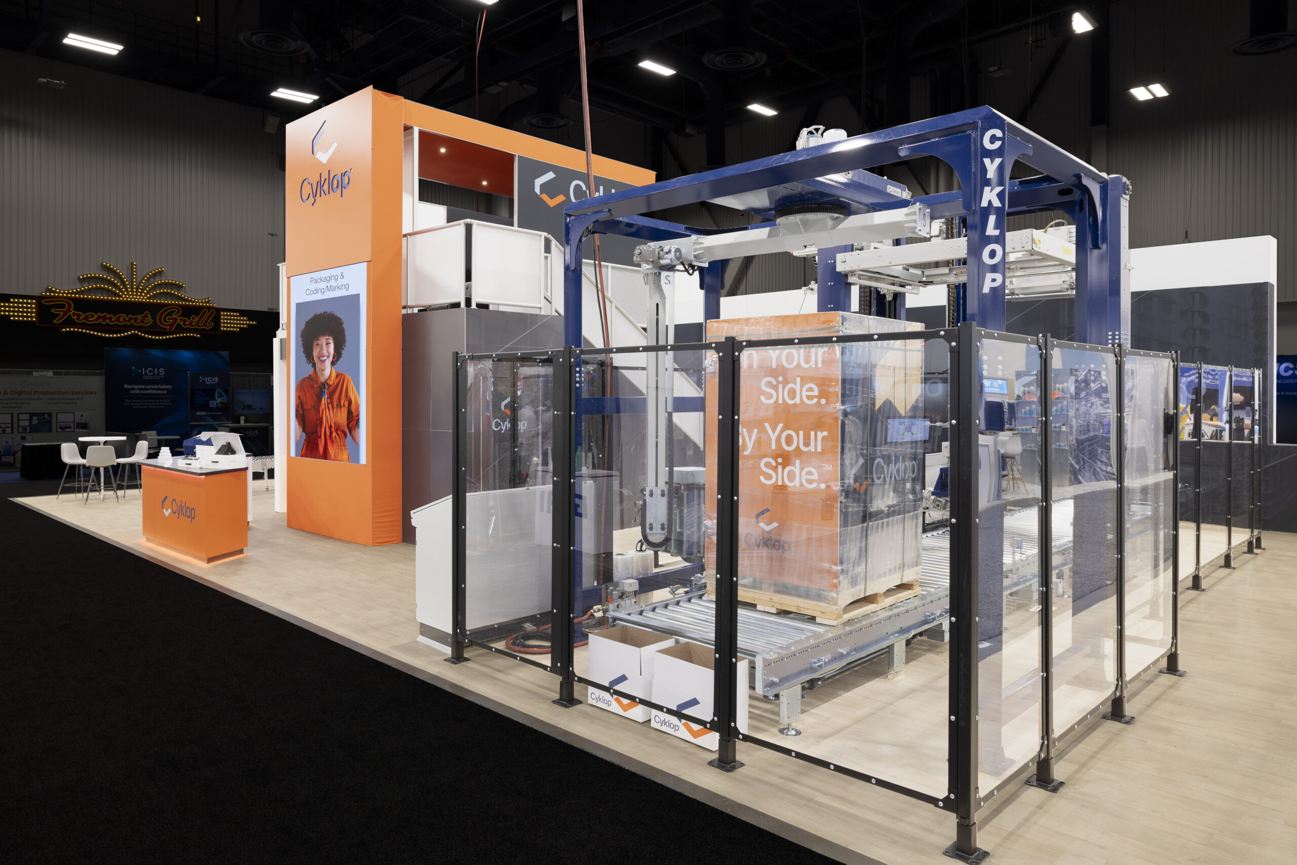 Cyklop packaging machinery displayed inside a custom trade show exhibit