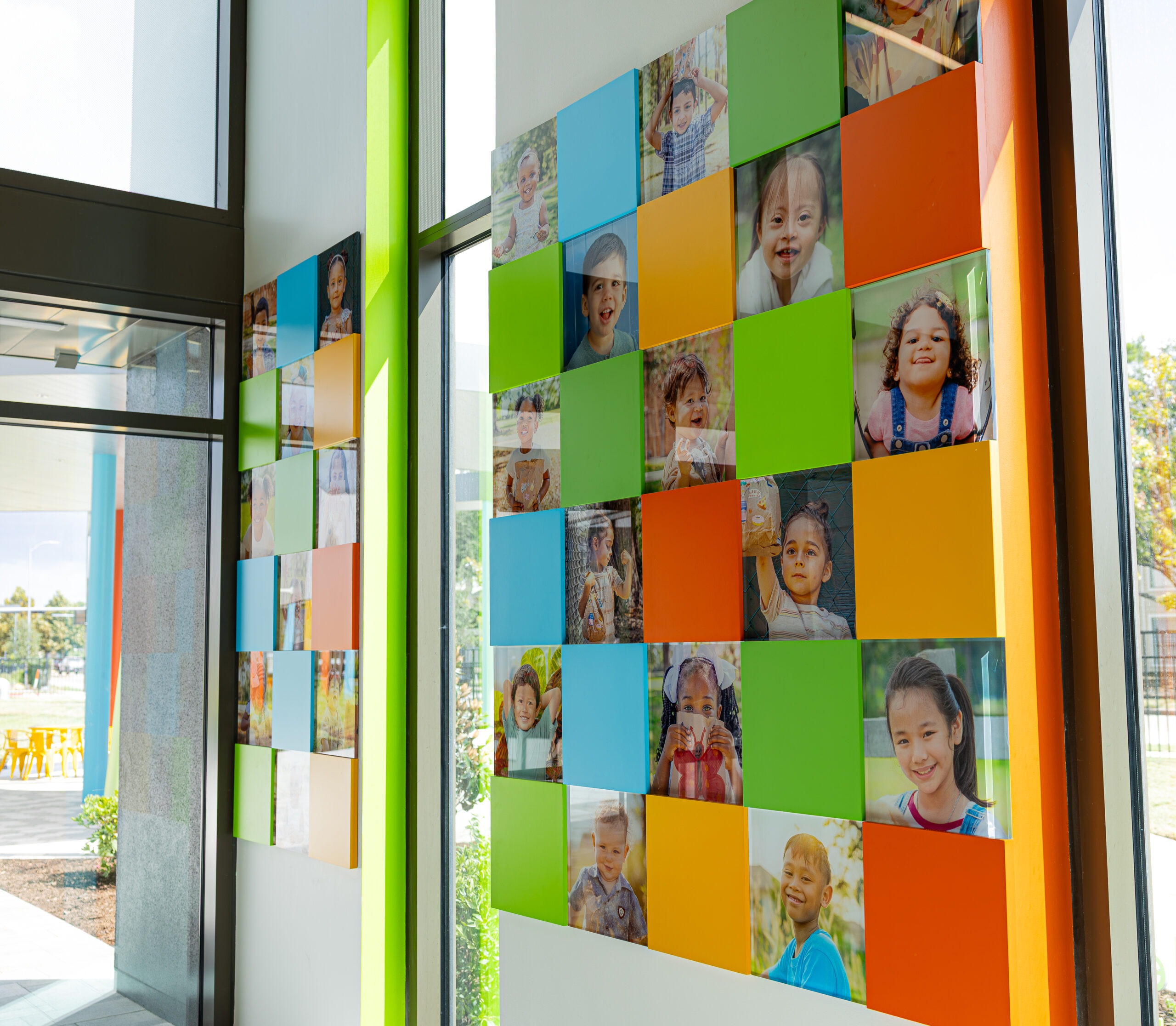 Kids' Meals branded facility interior featuring colorful mission-focused environmental graphics